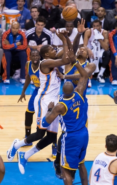 Durant attempts to float one over the Warrior defense.