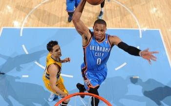 Westbrook skys for the sick one-handed throw-down as Evan Fournier watches helplessly.
