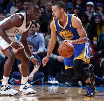 Stephen Curry goes one-on-one with Reggie Jackson. Curry's 37 points and 11 assists weren't enough to seal a Warrior win. Jackson threw down 14 points of his own.