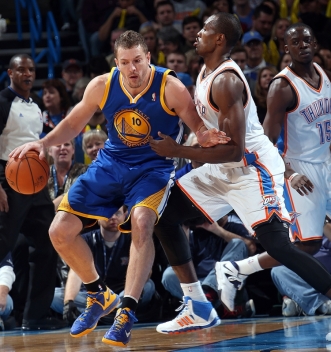 David Lee tries to back down Ibaka. Lee finished the game with 13 points.
