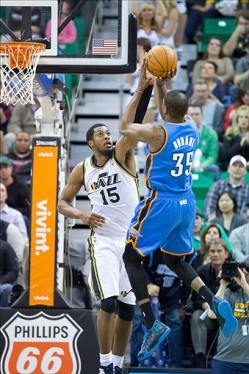 Kevin Durant shoots over the outstretched arm of Derrick Favors. Durant ended his night tying his season-high 48 points, while Favors finished with 15 points.