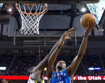 Durant tries to get one past Marvin Williams. Williams finished the game with 12 points.
