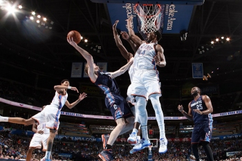 Cody Zeller attempts the fadeaway over the defense of Hasheem Thabeet. Zeller posted 10 points off of the Bobcats bench.