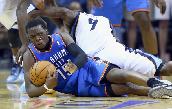 Reggie Jackson beats Tony Allen to the loose ball. Bench player Jackson's 32 points not only led all scorers to take the floor, but also marked a career-high.
